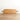 Long rectangle charcuterie board with handle on both ends. Relclaimed oak with natural color and wood grains. Leaning against white wall