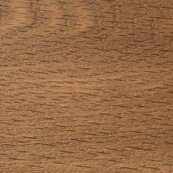 Close-up of a wooden surface with a brown color and visible grain pattern.